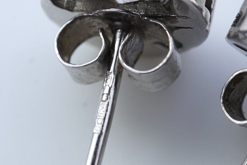 A pair of diamond stud earrings